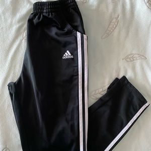 Black Adidas pants.